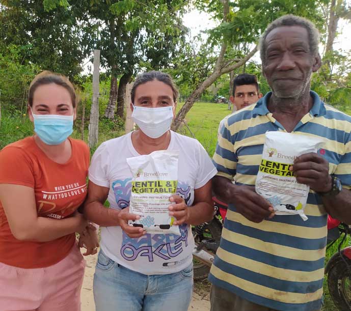 Image of a Breedlove food packets being received by those in need.
