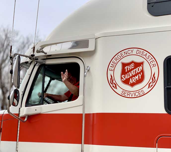 Image of a Salvation Army delivery truck, working in coordination with Breedlove Foods to deliver food.